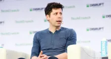 OpenAI CEO Sam Altman speaking on stage at TechCrunch Disrupt.